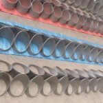 Rows of 304 and 316 stainless steel pipe sections with angled cut ends